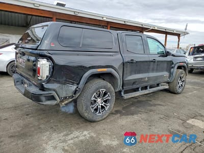 Trzecie zdjęcie samochodu z tyłu: 2023 GMC CANYON AT4 VIN:1GTP6DEK5P1174570 - miniatura