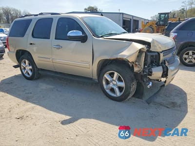 Czwarte zdjęcie samochodu z boku: 2011 CHEVROLET TAHOE K1500 LTZ VIN:1GNSKCE0XBR187525 - miniatura