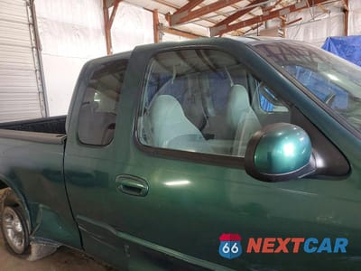 Zdjęcie 10 z 12 samochodu: 1999 FORD F150 VIN:1FTRX18L1XNA06068 - miniatura