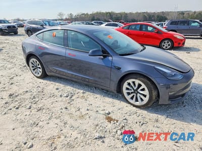 Czwarte zdjęcie samochodu z boku: 2022 TESLA MODEL 3 VIN:5YJ3E1EA7NF285942 - miniatura