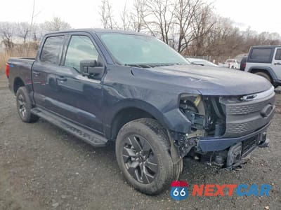 Czwarte zdjęcie samochodu z boku: 2024 FORD F150 LIGHTNING XLT VIN:1FT6W3L74RWG26910 - miniatura