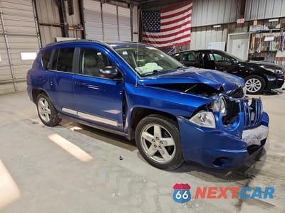 Czwarte zdjęcie samochodu z boku: 2010 JEEP COMPASS LIMITED VIN:1J4NT5FB9AD515487 - miniatura