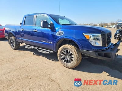 Czwarte zdjęcie samochodu z boku: 2017 NISSAN TITAN XD PRO-4X 4WD 5.0L V8 TDSL VIN:1N6BA1F41HN508432 - miniatura