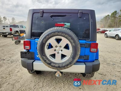 Zdjęcie 6 z 13 samochodu: 2011 JEEP WRANGLER UNLIMITED SAHARA VIN:1J4HA5H12BL632987 - miniatura