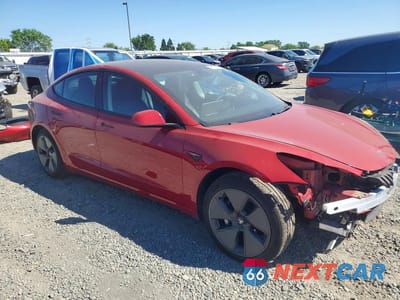 Czwarte zdjęcie samochodu z boku: 2021 TESLA MODEL 3 VIN:5YJ3E1EB1MF974110 - miniatura