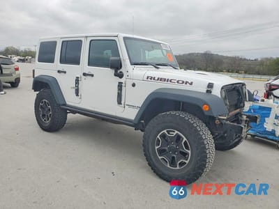 Czwarte zdjęcie samochodu z boku: 2016 JEEP WRANGLER UNLIMITED RUBICON VIN:1C4BJWFG7GL291649 - miniatura