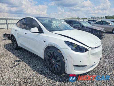 Czwarte zdjęcie samochodu z boku: 2022 TESLA MODEL Y VIN:7SAYGDEF2NF502457 - miniatura