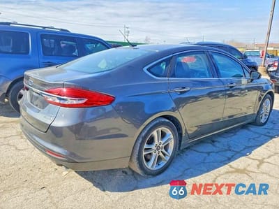 Trzecie zdjęcie samochodu z tyłu: 2018 FORD FUSION SE HYBRID VIN:3FA6P0LU4JR152214 - miniatura