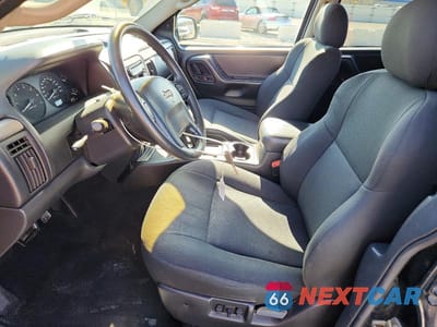 Zdjęcie 7 z 13 samochodu: 2002 JEEP GRAND CHEROKEE LAREDO VIN:1J4GW48S72C151553 - miniatura