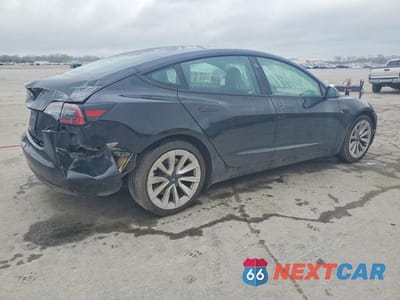 Trzecie zdjęcie samochodu z tyłu: 2023 TESLA MODEL 3 VIN:5YJ3E1EB6PF391990 - miniatura