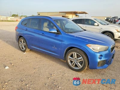 Czwarte zdjęcie samochodu z boku: 2017 BMW X1 SDRIVE28I VIN:WBXHU7C30H5H38763 - miniatura