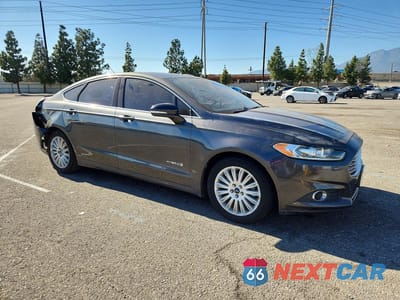 Czwarte zdjęcie samochodu z boku: 2015 FORD FUSION SE HYBRID VIN:3FA6P0LU1FR160889 - miniatura