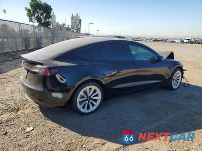 Trzecie zdjęcie samochodu z tyłu: 2022 TESLA MODEL 3 VIN:5YJ3E1EA7NF290493 - miniatura