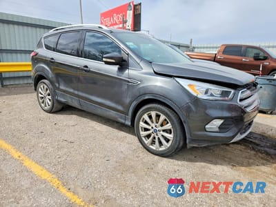 Czwarte zdjęcie samochodu z boku: 2018 FORD ESCAPE TITANIUM VIN:1FMCU0J99JUB16785 - miniatura