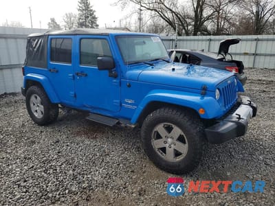 Czwarte zdjęcie samochodu z boku: 2011 JEEP WRANGLER UNLIMITED SAHARA VIN:1J4BA5H1XBL548650 - miniatura
