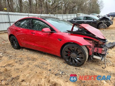 Czwarte zdjęcie samochodu z boku: 2022 TESLA MODEL 3 VIN:5YJ3E1EC7NF199614 - miniatura