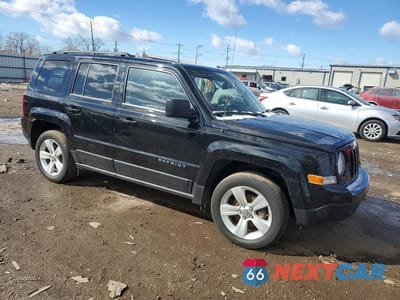 Czwarte zdjęcie samochodu z boku: 2014 JEEP PATRIOT LATITUDE VIN:1C4NJPFA0ED563299 - miniatura