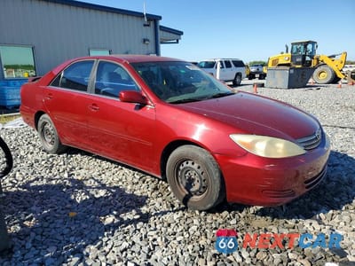 Czwarte zdjęcie samochodu z boku: 2002 TOYOTA CAMRY LE VIN:JTDBE32K320038013 - miniatura