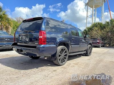 Czwarte zdjęcie samochodu z boku: 2007 CHEVROLET SUBURBAN K1500 VIN:1GNFK16377J321296 - miniatura