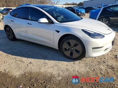Czwarte zdjęcie samochodu z boku: 2021 TESLA MODEL 3 VIN:5YJ3E1EB2MF943660 - miniatura