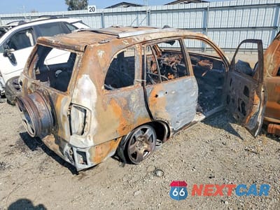 Trzecie zdjęcie samochodu z tyłu: 2003 TOYOTA RAV4 BASE VIN:JTEGH20V930097780 - miniatura
