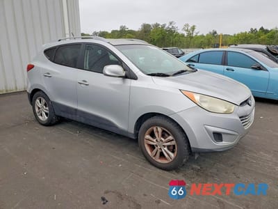 Czwarte zdjęcie samochodu z boku: 2010 HYUNDAI TUCSON GLS VIN:KM8JU3AC4AU034435 - miniatura