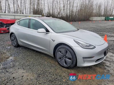 Czwarte zdjęcie samochodu z boku: 2018 TESLA MODEL 3 VIN:5YJ3E1EB1JF104465 - miniatura
