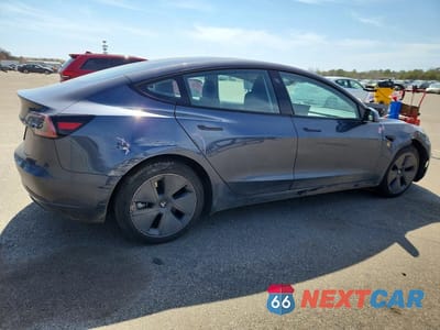 Trzecie zdjęcie samochodu z tyłu: 2023 TESLA MODEL 3 VIN:5YJ3E1EA3PF687265 - miniatura