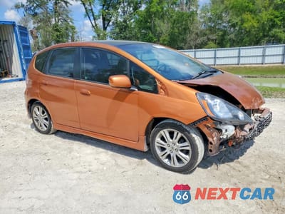 Czwarte zdjęcie samochodu z boku: 2011 HONDA FIT SPORT VIN:JHMGE8H58BS009937 - miniatura