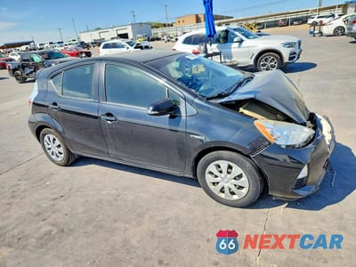 Czwarte zdjęcie samochodu z boku: 2014 TOYOTA PRIUS C TWO VIN:JTDKDTB30E1565002 - miniatura