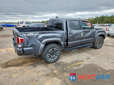 Trzecie zdjęcie samochodu z tyłu: 2023 TOYOTA TACOMA TRD SPORT VIN:3TMAZ5CNXPM208988 - miniatura