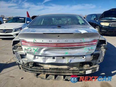 Zdjęcie 6 z 13 samochodu: 2016 LINCOLN MKZ HYBRID VIN:3LN6L2LU7GR624718 - miniatura