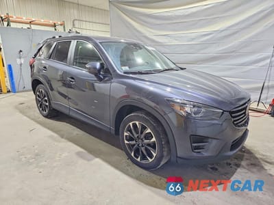 Czwarte zdjęcie samochodu z boku: 2016 MAZDA CX-5 GT VIN:JM3KE4DY5G0727041 - miniatura