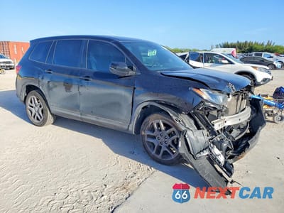 Czwarte zdjęcie samochodu z boku: 2022 HONDA PASSPORT EXL VIN:5FNYF8H53NB025371 - miniatura