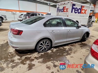 Trzecie zdjęcie samochodu z tyłu: 2016 VOLKSWAGEN JETTA UNKNOWN VIN:3VWD67AJXGM311357 - miniatura
