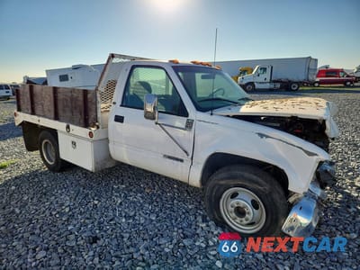 Czwarte zdjęcie samochodu z boku: 2000 CHEVROLET GMT-400 FLATBED TRUCK VIN:1GBJC34J0YF404316 - miniatura