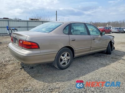 Trzecie zdjęcie samochodu z tyłu: 1999 TOYOTA AVALON XLS VIN:4T1BF18B3XU310306 - miniatura