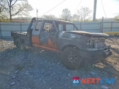 Czwarte zdjęcie samochodu z boku: 1997 FORD F250 SUPER DUTY FLATBED TRUCK VIN:1FDHX25F2VEB17060 - miniatura