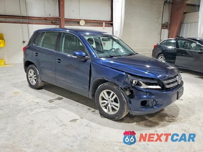 Czwarte zdjęcie samochodu z boku: 2014 VOLKSWAGEN TIGUAN S VIN:WVGBV3AX5EW611679 - miniatura
