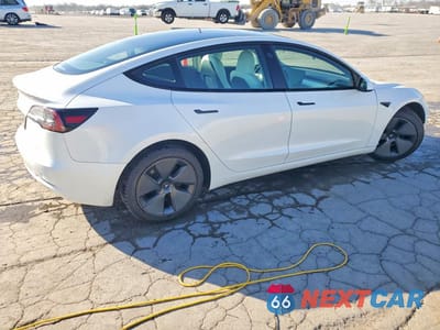 Trzecie zdjęcie samochodu z tyłu: 2023 TESLA MODEL 3 VIN:5YJ3E1EA2PF566680 - miniatura