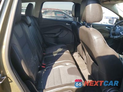 Zdjęcie 10 z 11 samochodu: 2013 FORD ESCAPE TITANIUM VIN:1FMCU0J94DUB62240 - miniatura