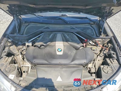 Zdjęcie 12 z 13 samochodu: 2014 BMW X5 XDRIVE50I VIN:5UXKR6C5XE0J73619 - miniatura