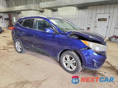 Czwarte zdjęcie samochodu z boku: 2011 HYUNDAI TUCSON GLS VIN:KM8JU3AC9BU272685 - miniatura