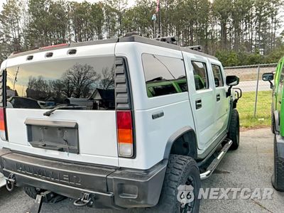 Czwarte zdjęcie samochodu z boku: 2003 HUMMER H2 VIN:5GRGN23U63H136857 - miniatura