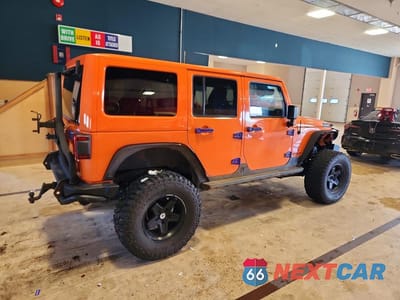 Trzecie zdjęcie samochodu z tyłu: 2012 JEEP WRANGLER UNLIMITED SPORT VIN:1C4BJWDG0CL244637 - miniatura