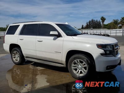 Czwarte zdjęcie samochodu z boku: 2015 CHEV TAHOE C1500 LT VIN:1GNSCBKC1FR505396 - miniatura