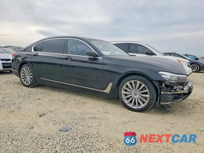 Czwarte zdjęcie samochodu z boku: 2016 BMW 740 I VIN:WBA7E2C50GG504663 - miniatura