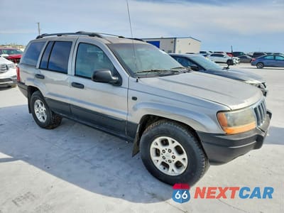 Czwarte zdjęcie samochodu z boku: 2000 JEEP GRAND CHEROKEE LAREDO VIN:1J4GW48S2YC394602 - miniatura