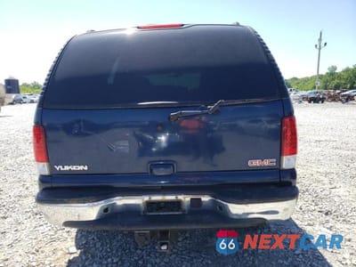 Zdjęcie 6 z 12 samochodu: 2003 GMC YUKON VIN:1GKEC13Z73R264611 - miniatura