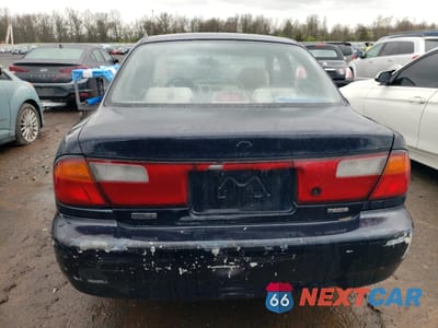 Zdjęcie 6 z 12 samochodu: 1998 MAZDA PROTEGE DX VIN:JM1BC1418W0234016 - miniatura
